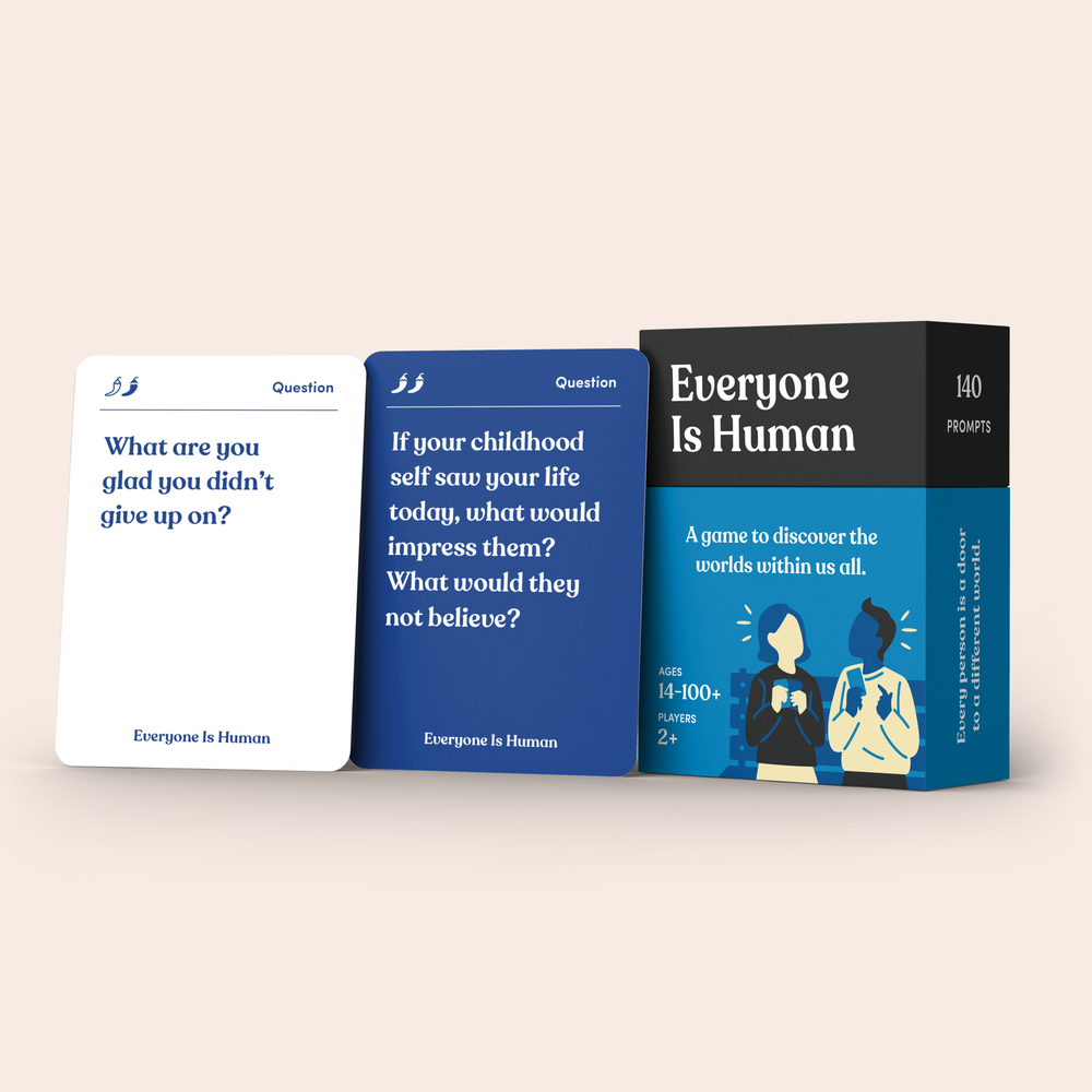 Everyone Is Human card deck standing beside its cards
